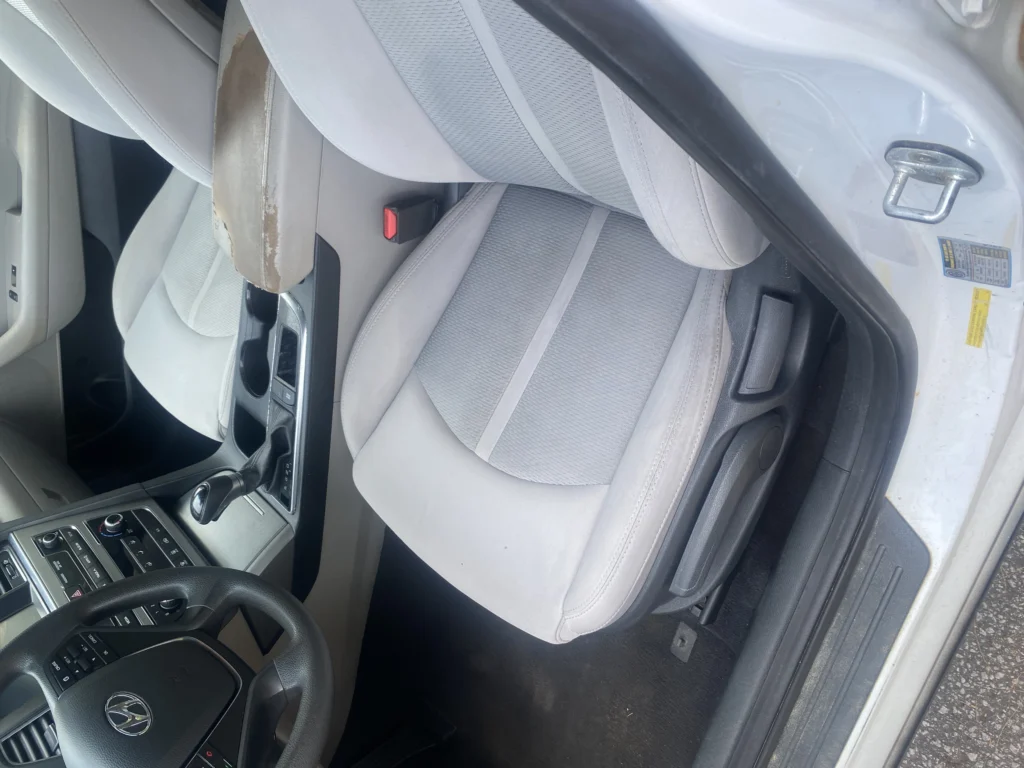 The same cloth car seat cleaned and extracted after a mobile interior detail in Spartanburg SC
