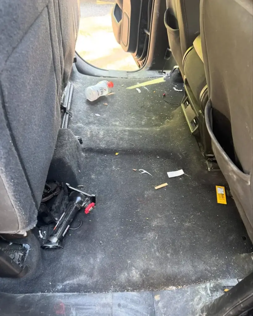 Dirty car carpet with trash and stains before a mobile interior detail in Spartanburg SC