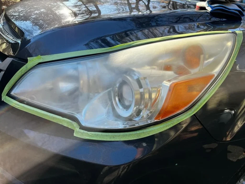 Yellowed oxidized headlight lens before headlight restoration in Spartanburg SC