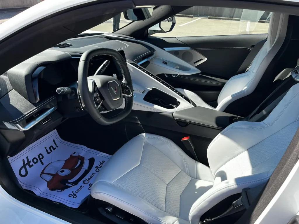 Freshly detailed Corvette interior with clean leather seats and dashboard, mobile interior detailing in Spartanburg SC